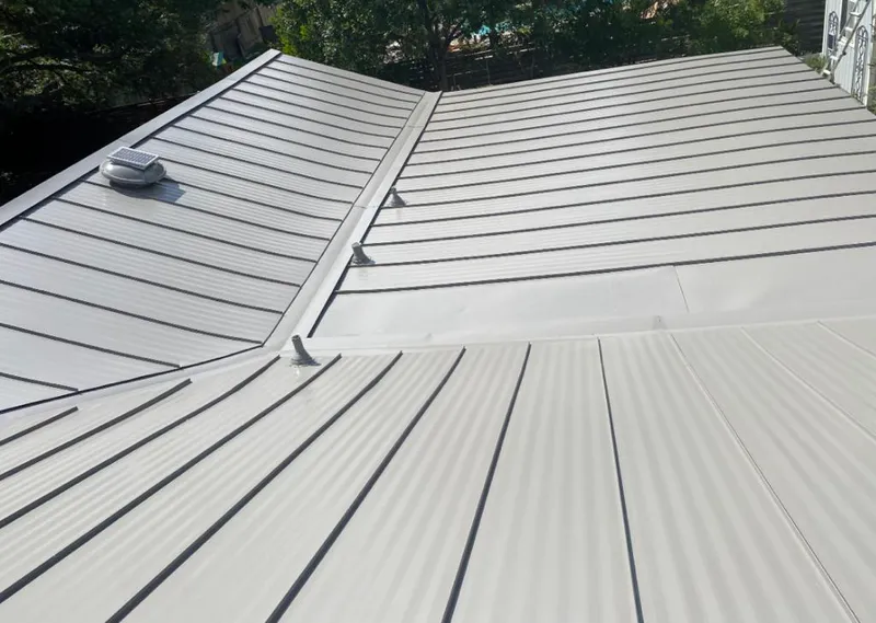 Solar attic fan installed on a metal roof for Roof Ventilation in Estacada